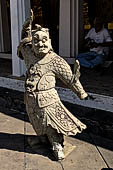 Bangkok Wat Arun - the gallery is lined all around with beautiful statues of chinese figures. 